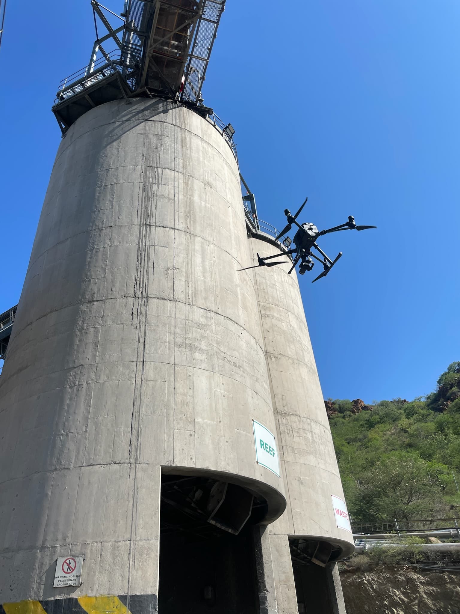 Drone Solutions International aircraft inspecting industrial infrastructure